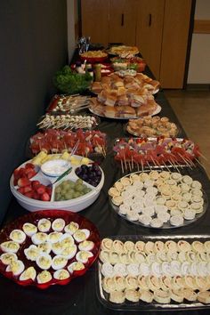 an assortment of appetizers and snacks on a buffet table