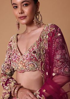 Discover the epitome of sophistication with our bacon pink to coral peach raw silk and velvet lehenga. A beautiful masterpiece of exquisite craftsmanship this ensemble is adorned with 3D pearls glimmering crystal and intricate zardosi embroidery. Decked with stunning Mughal and floral motifs this 16kali lehenga is complemented with an embellished blouse and two dupattas. Dry clean only if required. Slight variation in color is possible due to digital photography. Designer Lehenga With Intricate Embroidery In Pink, Bridal Lehenga Sabyasachi, Transitional Season Pink Lehenga With Intricate Embroidery, Coral Pink Lehenga, Glamorous Pink Lehenga With Intricate Embroidery, Luxury Embroidered Peach Lehenga, Pink Bridal Lehenga, Velvet Lehenga, Bridal Lehenga Designs