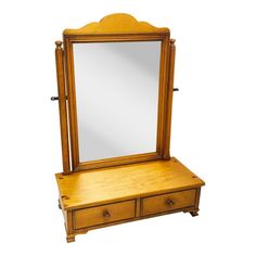 an antique wooden dressing table with mirror and drawers