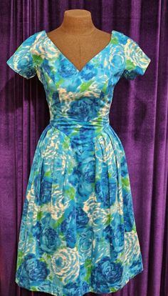 This pretty, silky dress is in excellent vintage condition.  Please be sure to note the flattering 5" long cap sleeves, the V of the decolletage and in the back, as well, the corresponding V at the waist in the front and pleats, front and back; note, too, the 2" wide waistband in the back that closes via snaps.  The attached tulle crinoline was sewn into the dress and bears a size 10 tag - which would make it equivalent to approximately a size 4-6 today. Approximate measurements: shoulder to shoulder:  12.5" armpit to armpit:  15" waist (flat):  12" hips (flat):  15" back length: 43" back metal zipper:  14" What a wonderful addition to your vintage clothing collection; it is a beautiful example of 1950s wearable textile art and fashion. We want you to love your purchase; if there is a prob Green And White Dress, 1960s Dresses, Silky Dress, Shopping Websites, 1950s Vintage, Metal Zipper, Wide Waistband, Dress Clothes For Women, Green And White