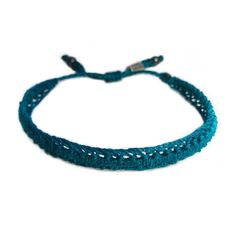 SUMMER WOVEN BRACELET: This hand-knotted, unisex, woven bracelet includes two genuine Hematite stones and a Rumi Sumaq logo bead. In a beautiful color shade of deep turquoise blue, the bracelet makes a wonderful beach accessory for summer. Purchase two as adult friendship bracelets or as a unique "his and her" couples bracelet set. Custom made in all wrist sizes, this bracelet could also be a great parent-child bracelet set.SUPERIOR CRAFTSMANSHIP:Please don't confuse this woven bracelet with you Adjustable Hand Knotted Bracelets For Gifts, Adjustable Hand Knotted Bracelets As Gift, Adjustable Turquoise Friendship Bracelets With Sliding Knot, Turquoise Adjustable Cord Friendship Bracelets, Casual Braided Bracelet Jewelry, Casual Braided Bracelet, Handmade Turquoise Braided Bracelets In Spiritual Style, Adjustable Turquoise Friendship Bracelets, Handmade Turquoise Spiritual Braided Bracelets