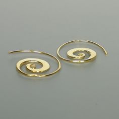 Sterling silver gold plated spiral hoops. Comes with a hammered finish. Dimensions: Inner spiral: 18 x 15 x3 mm Outer: 22 x25 mm These earrings are made of 925 hypoallergenic sterling silver. Please note this price is for ONE PAIR only. All my pieces are sent in a gift box. I can include a personal message from you if needed You are welcome to contact me at... bhavnakwintra1956@gmail.com For more beautiful pieces from my shop, please browse 👇 TOE RINGS: https://www.etsy.com/your/shops/TheSilver Gold Spiral Hoop Earrings Nickel-free, Gold Spiral Hoop Earrings Nickel Free, Nickel-free Spiral Gold Hoop Earrings, Yellow Gold Spiral Earrings With Ear Wire, Gold Spiral Minimalist Earrings, Minimalist Gold Spiral Earrings, Gold Spiral Hoop Earrings Gift, Spiral Yellow Gold Hoop Earrings For Gift, Spiral Yellow Gold Hoop Earrings As Gift