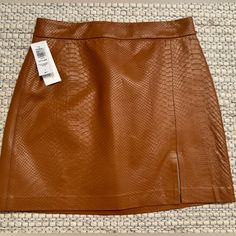 Aritzia Wilfred Patio Mini Skirt Brown Python-Embossed Vegan Leather High Rise New With Tags And Never Worn Approx 15” Length This Is A High-Waisted A-Line Mini Skirt With A Thigh Slit. It's Made With Our Python-Embossed Vegan Leather, Crafted To Look And Feel Like The Real Thing. Brown Leather Mini Skirt, Leather Mini Skirt, A Line Mini Skirt, Aritzia Wilfred, Leather Mini Skirts, Leather Mini, Python, Vegan Leather, Mini Skirt