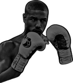 a black and white photo of a man wearing boxing gloves