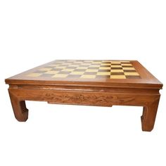 a wooden coffee table with chess board on top