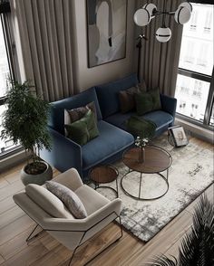 a living room with two couches, chairs and a coffee table in front of large windows