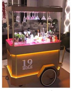 an old fashioned ice cream cart with drinks on it