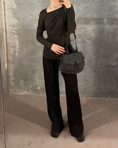 Marc Le Bihan's Asymmetrical Long Sleeve top features a gathered shoulder and pleats towards the back that allow the top to twist around the body. Worn here with the Jaga Meloni pants, the Maison Margiela Suede Tabi boots and the Kiko Kostadinov Petite Chalkboard Mezulari bag.