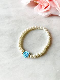 Pearl Flower Bracelet. Beaded Pearl Bracelet. Pink Flower - Etsy Blue Beaded Bracelet With Pearl Charm, Adjustable Blue Beaded Bracelet With Pearl Charm, Adjustable Pearl Bracelet With Flower Shape, Adjustable Flower Pearl Bracelets, Adjustable Flower-shaped Pearl Bracelets, Adjustable Flower-shaped Pearl Bracelet, Blue Flower Bracelet, Beaded Braclets, Gold Pearl Jewelry