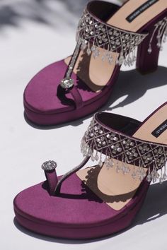 Purple heels with stones, beads embellishments on the strap, heels and toe ring.
Composition: Satin
Color: Purple
Other Details: 
Tassel detailing
Heel height (in inches): 4.75
Weight (in grms): 800 - Aza Fashions Luxury Rhinestones Heels For Reception, Luxury Embellished Heels For Reception, Embellished Heels For Reception, Glamorous Party Heels For Festive Occasions, Hand Embellished Heels For Party, Purple Heels Wedding, Purple Sandals, Purple Heels, Heel Accessories