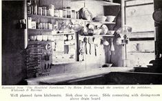 an old black and white photo of a kitchen with lots of utensils hanging on the wall