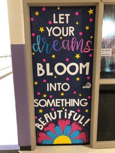 a door with the words let your dreams bloom into something beautiful and bewitting