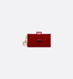 The Lady Dior Jasmine card holder pays tribute to the Dior leather artisans' savoir-faire with its timeless Cannage topstitching. Crafted in cherry red patent calfskin, the style is compact and functional and can accommodate the daily essentials. Embellished with detachable D.I.O.R. charms and a snap flap closure, the gusset card holder can be coordinated with other Lady Dior creations.. Dior Star, 2024 Wishlist, Luxury Christmas Gifts, Leather Craftsmen, Dior Book Tote, Leather Artisan, Silver Cufflinks, Fashion Jewelry Earrings, The Lady