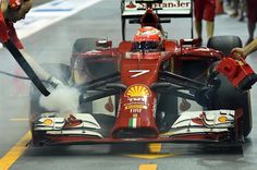 Kimi Raikkonen (FIN) Ferrari F14 T with brakes on fire. Formula One World Championship, Rd14, Singapore Grand Prix, Marina Bay Street Circuit, Singapore, Practice, Friday, 19 September 2014 Kimi Raikkonen Ferrari, F1 Pictures, Singapore Grand Prix, Kimi Raikkonen, Singapore Airlines, Formula 1 Car, Car Images, World Championship, Marina Bay