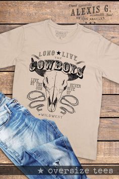 LONG LIVE THE COWBOYS GRAPHIC OVERSIZE TEES Our Shirts are Authentically Designed and Hand Screen Printed for Best Quality *Process where the ink is dyed into the shirt and graphic will not peel away -Proudly Hand Pressed in Los Angeles, CA. -30 Singles. 100% Washed Cotton -Comfortable and Very Soft -Style by Rolling up the Sleeves, Tie a Side Knot, Front Tuck... SIZE AND FIT *Please refer to the last photo option for measurements WASHING AND CARE -Machine Wash with Like Colors -Tumble Dry Low - Bulls Skull, Cowgirl T Shirt, Vintage Western Shirt, Mama Cloth, Oversize Tee, Cowboy Shirt, Front Tuck, Skull Shirt, Screen Printing Shirts