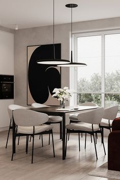 a modern dining room with white chairs and black artwork