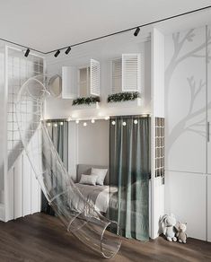 a bedroom with white walls, wooden floors and a clear plastic chair in the foreground