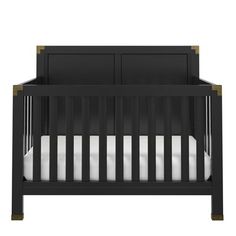 a black crib with white sheets on the bottom and two doors at the top