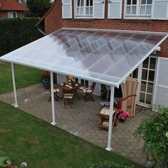 a patio covered with a white plastic covering