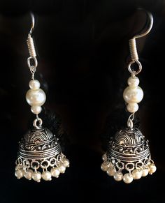 PEARL JHUMKA EARRINGS Jhumkas are the calling on the runway ramps this year. This is a traditional artist Jhumki handmade with love. Finished up with beautiful white pearls , A very hot pair for this season. The length of the earrings is 2.5 inches from top to the tip of the earring. lightweight ' If you want unique this season then these are a pair you must own. wear temple art and become a part of rich tradition. Thank you for your support Go back to Storefront Taneesijewelry.etsy.com View my Luxury Temple Jewelry Jhumkas With Latkans, Cheap Silver Temple Jewelry Earrings, White Fusion Danglers With Latkans, Silver Jhumkas With Latkans For Festival, Silver Jhumkas For Festival, Elegant Dangle Jhumkas For Festivals, Elegant Silver Jhumkas For Festival, Elegant Jhumkas For Festive Occasions, Elegant Heavy Jhumkas For Festival