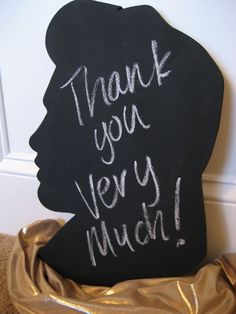 a thank you very much sign in front of a blackboard with the words'thank you very much'written on it