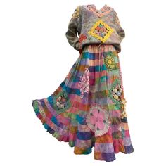 a colorful dress with flowers and butterflies on the front, made out of multicolored fabric