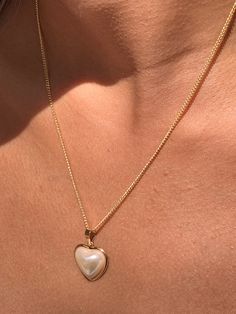 "18 Karat Gold Filled Pearl Heart Charm Necklace The perfect addition to layering with other 14\" or 16\" inch dainty gold chains. An elegant, simple piece that transitions well for daily wear. Material: 18 Karat Gold Filled, Hypoallergenic, Tarnish Resistant. Pendant Size: 17mm x 18mm (without bail) Chain Length: Options available Material: 18 Karat Gold Filled, Hypoallergenic. Tarnish Resistant. Gold-filled does not de-laminate or peel like Gold plated Jewelry nor does it tarnish as readily as Heart Necklace With Pearl Chain For Gift, Anniversary Heart Pendant Pearl Necklace, White Heart Pendant Necklace With Pearl Drop, Heart-shaped Pearl Necklace For Anniversary, Valentine's Day Heart Pendant Necklace With Pearl Chain, Pearl White Heart-shaped Jewelry With Heart Charm, Heart Pendant Necklace With Pearl Charm For Anniversary, Gold Heart Pendant Pearl Necklace For Anniversary, Gold Heart-shaped Pearl Necklace For Gift