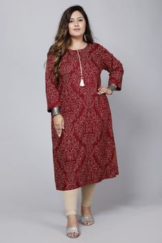 About: Upgrade your wardrobe with our Maroon Color Bandhini Print Women's Plus Size Kurti. ,This stunning piece features a bold maroon color and intricate bandhini print, perfect for making a statement. Made with the highest quality materials, our kurti offers both style and comfort for plus size women. Add a touch of elegance to any outfit with this versatile piece. Chest Size: Medium: 38 Inches Large: 40 Inches X-Large: 42 Inches XX-Large: 44 Inches XXX-Large: 46 Inches FABRIC: Cotton Sleeve t Plus Size Kurti Designs, Sequence Blouse, Indo Western Gown, Saree Petticoat, Full Sleeve Blouse, Saree Jewellery, Lehenga Skirt, A Line Kurta, Ready To Wear Saree