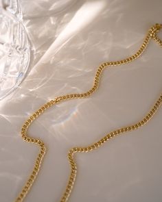 Make a statement with the Tribeca Curb Chain Choker! Perfect for layering and creating unique looks, this choker will provide a subtle but bold look. Express yourself and show off your style with the Tribeca Curb Chain Choker! NECKLACE FEATURES Material: Brass, 16K Gold Filled Chain Dimension: 3X2.2mm Chain Thickness: 0.4mm Chain Style: Curb Chain Lead Free, Nickel Free Size: 16" with 2" chain extender Formal Metal Curb Chain Necklace, Elegant Snake Chain Choker With Adjustable Chain, Elegant Gold Snake Chain Choker, Modern Chain Link Choker With Adjustable Chain, Luxury Chunky Chain Choker Necklace, Cuban Link Metal Necklace For Formal Occasions, Elegant Cuban Link Double Chain Jewelry, Formal Cuban Link Necklace With Adjustable Chain, Elegant Formal Necklace With Chain Strap