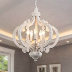 a white chandelier hanging from the ceiling