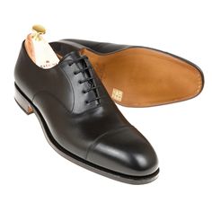 Lace-up oxford cap toe in black box calf. Classic Cap Toe Oxford With Goodyear Welt, Classic Cap Toe Oxford Shoes With Goodyear Welt, Classic Goodyear Welted Cap Toe Oxford, Classic Black Cap Toe Derby, Classic Black Cap Toe Derby Shoes, Cordovan Shoes, Wingtip Oxford Shoes, Oxfords Shoes, Brown Oxfords