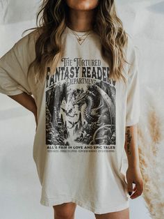 ✺ THE TORTURED FANTASY READERS DEPARTMENT  GRAPHIC SHIRT  ✺ Get this trendy Comfort Colors graphic tee. * Q U I C K F A C T S * This design is a unique, one-of-a-kind awesome illustration that has been created in house. ✺ 100% Cotton (fiber content may vary for different colors) ✺ Classic fit ✺ Sizing is unisex so runs like men's, though not overly large ✺ Most women find their typical size works best, since they are meant to fit a touch loose This is a Unisex T-Shirt which you can use as an Ove Booktok Merch, Oversized T Shirt Dress, Bookish Things, Embroidered Tee, Love Shirt, Book Lovers Gifts, Book Lover, Graphic Shirts, Etsy Australia