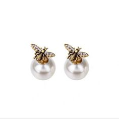 The Tribales earrings are an iconic and timeless style. The asymmetric style features a signature white resin pearl at the back, covered in symbols cherished by the House, The front and back may be mixed and matched with other Tribales pieces, creating infinite possible looks.