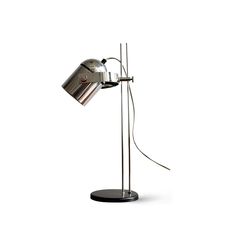 a lamp that is sitting on top of a metal stand with a white light behind it