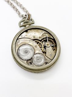 Elwood, Antique Jeweled Pocket Watch Necklace  #neovictorian #industrialdesign #victorianmagpie #industrial #clockworks #ilm #industrialjewelry #handmadejewelry #newfromold #history Luxury Polished Pocket Watch For Collectors, Vintage Medallion Pocket Watch With Skeleton Dial, Steampunk Engraved Pocket Watch As Gift, Silver Steampunk Pocket Watch With Locket, Steampunk Silver Pocket Watch With Locket, Vintage Skeleton Dial Pocket Watch As Gift, Silver Antique Finish Pocket Watch Gift, Steampunk Pocket Watch With Compass Design, Vintage Engraved Pocket Watch For Gift