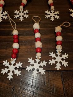 some snowflakes and beads are on a table