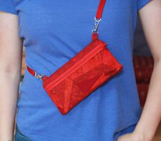 "There are three ways to wear this bag.  1. Clip-on to your belt loop for an easy hands free option 2. Crossbody 3. Over the shoulder  It can also be clipped onto your luggage or backpack.  It can easily carry a 6\" long phone, credit cards, sunglasses, and other everyday essentials in the main and front pockets. Every pouch is uniquely pieced together from remnant pieces of fabric from previous projects. The bag is 8\" long and 4\" deep with a zipper opening of 7\". The zipper front pocket is 8\" long and 3\" deep. The adjustable strap when fully extended is roughly 50\". Please visit my shop RemnantGuru for more clip-on pouch colors and designs. Products normally ship Wednesday morning, Thursday afternoon, and on Saturday." Morning Thursday, Thursday Afternoon, Wednesday Morning, Tuesday Morning, Hip Bag, Everyday Essentials, Hands Free, Credit Cards, Zipper Pouch