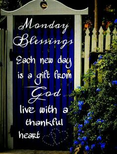 a blue and white door with a quote on it that reads monday blessing each new day is a gift from god live with a grateful heart