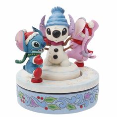 the figurine has three different characters on it