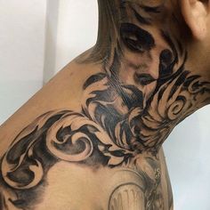 a man with a tattoo on his back