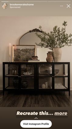 an advertisement for a furniture store with vases and plants on the sideboard in front of a mirror