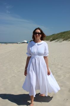 "Linen wedding dress with Peter Pan collar is simple and elegant and perfect for your perfect day! This handmade dress is made from soft, washed linen. Romantic dress with dropped shoulders and 3/4 long puff sleeves with elastic band, loose and flowy full circle skirt with side seam pockets and accented empire waistline. In the second picture you can find size table and choose your size, if you are not sure which size to choose, or can't find your size, please contact me for details or advice. I Classic White Linen Midi Dress, White Tea Length Summer Dress, Linen Midi Length Wedding Dress, Linen Midi Length Dress For Wedding, Linen Midi Dress For Wedding, White Linen Midi Dress For Garden Party, White Linen Maxi Dress For Wedding, Fitted Linen Maxi Dress For Wedding, Wedding Dress Cottagecore