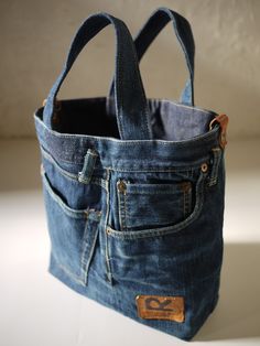 a denim bag is sitting on a table