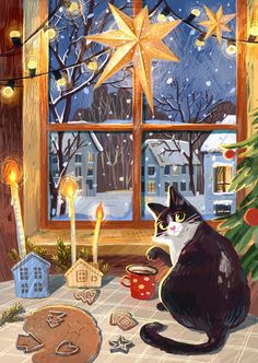 a black and white cat sitting in front of a window next to a christmas tree