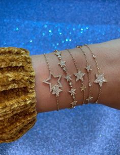 "𝓦𝓮𝓵𝓬𝓸𝓶𝓮 𝓽𝓸 𝓛𝓲𝓸𝓷𝓱𝓮𝓪𝓻𝓽 𝓳𝓮𝔀𝓮𝓵𝓻𝔂 𝓢𝓱𝓸𝓹 ♥ Beautiful and delicate Diamond Star Charm Bracelets available in 4 variations. Please allow 1-5 weeks for delivery. *Please check measurements below, items may appear larger on the screen. ♥ 5 mini Star Bracelet with pave diamonds with 6 bezel set diamonds Measurements: 5.5mm Length: 7\" adjustable to 6.5\" Diamonds: 0.29 Carats ♥ 1 Star Full Pave Diamond Single Star Bracelet with 6 bezel set diamonds Measurements: 14.5mm Length: Affordable Gold Jewelry With Star Charm, Luxury Dainty Star Jewelry, Diamond Star Gold Jewelry, Luxury Diamond Jewelry With Star Charm, Affordable Dangle Jewelry With Star Charm, Affordable Trendy Jewelry With Star Charm, Luxury Minimalist Jewelry With Star Charm, Cheap Sparkly Gold Jewelry, Cheap Casual Star-shaped Bracelets