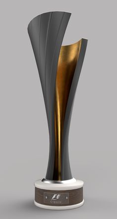 a silver and gold trophy with a wooden base on a gray background, it appears to be an award