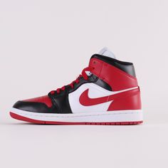 Debuted in 1985, the Air Jordan 1 Mid Red Black offers a rendition to the iconic classic. Released August 17th, 2022.* Jumpman logo on tongue* Leather and synthetic upper offers durability * Black wings logo on the side * Black, white and red colour blocking Size and Fit* Fits true to size Black Red And White Jordans, Red And Black Nike Shoes, Red And Black Jordans, Tenis Nike Jordan, Air Jordan 1 Mid Red, Jordan 1 Mid Red, Red And White Jordans, Black And White Jordans, Jordan 1 Red