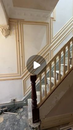 an image of a staircase being remodeled with paint and plaster on the floor in front of it