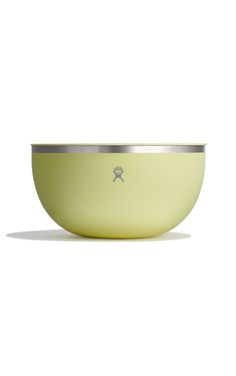 a yellow bowl sitting on top of a white table