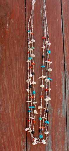 This Old Santo Domingo necklace is a classic accessory that you've been searching for. It is handcrafted with many different stones that include Turquoise, Coral, Onyx! This is that chic accessory that will enhance your casual or dressy wardrobe. Measures About: 31" long Weight: 42 grams Southwestern Multi-strand Necklace With Gemstone Beads, Southwestern Multi-strand Gemstone Bead Necklaces, Handmade Southwestern Long Necklace, Handmade Southwestern Style Long Necklace, Southwestern Multi-strand Beaded Necklace With Natural Stones, Southwestern Multi-strand Beaded Necklaces With Natural Stones, Southwestern Multi-strand Necklaces As Gift, Southwestern Multi-strand Necklace As Gift, Southwestern Multi-strand Polished Bead Necklaces